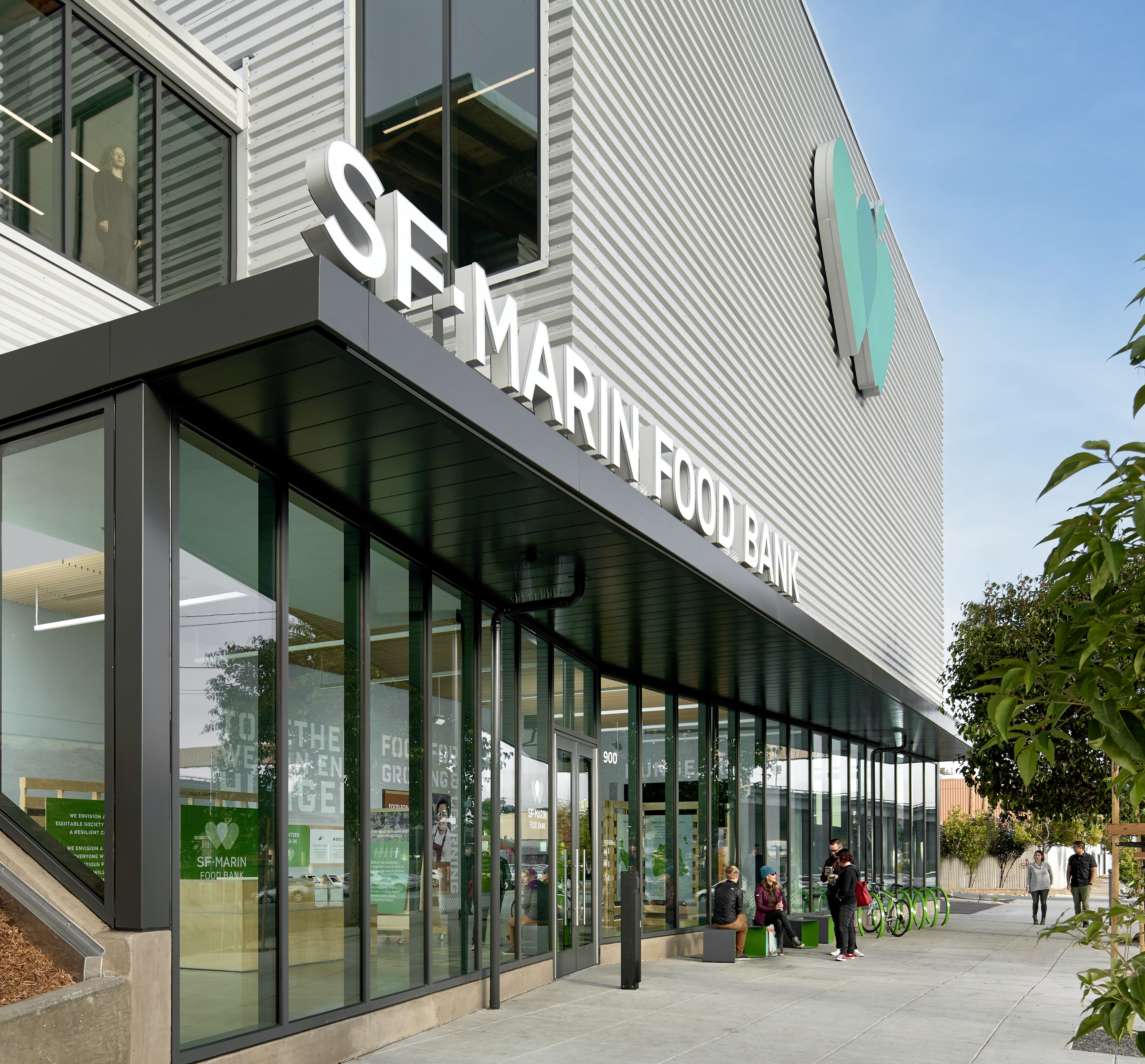 Front facade of building at sidewalk with SF Marin Food Bank logo and name above entry way.