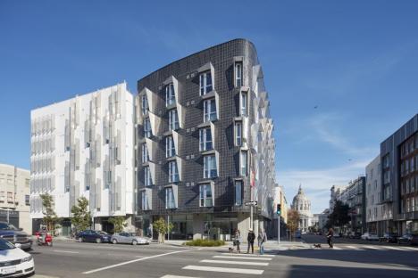 Exterior corner view of 388 Fulton at Gough Street; distinct black cladding is accented staggered windows.