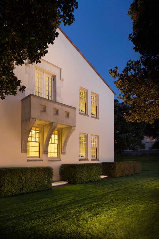 Exterior evening view of south side of Building 38 showing balcony architectural detail