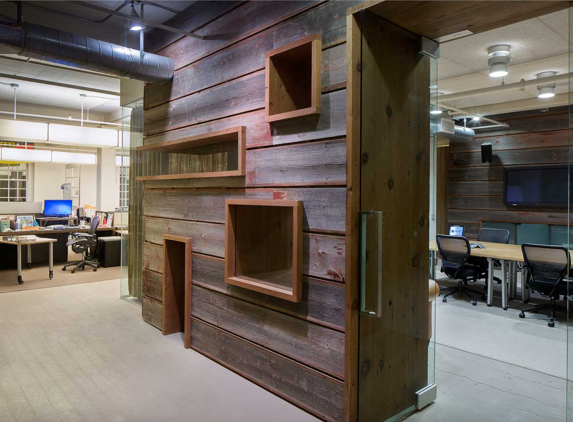 Suite 219 updated with rough-hewn wood cladding around a conference room entryway