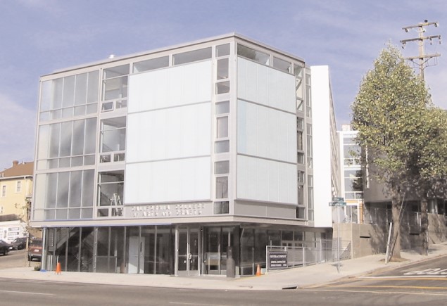 Exterior daytime view of building exterior with modern glass walls and metal structure