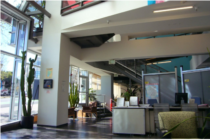 Interior daytime view of ground-floor entry, lobby, reception, and seating areas