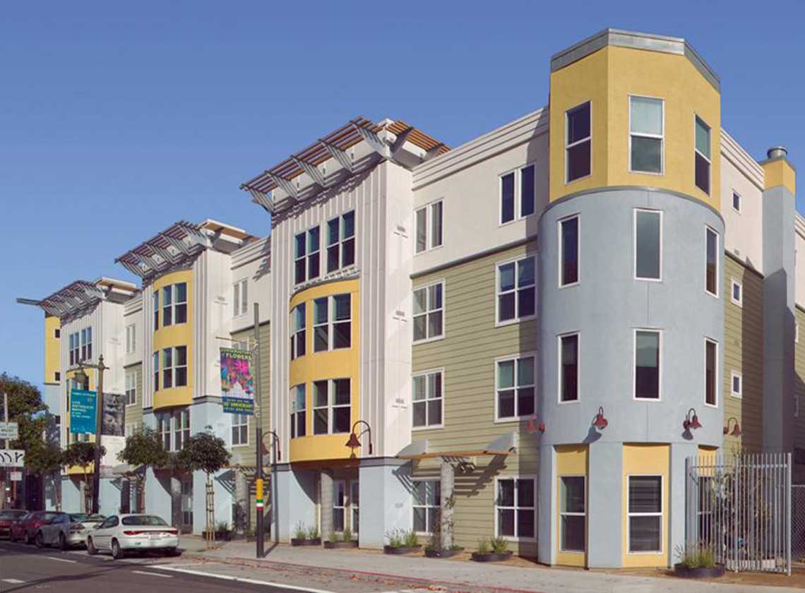 Exterior daytime view of building architecture with colorful paneling and decorative overhangs