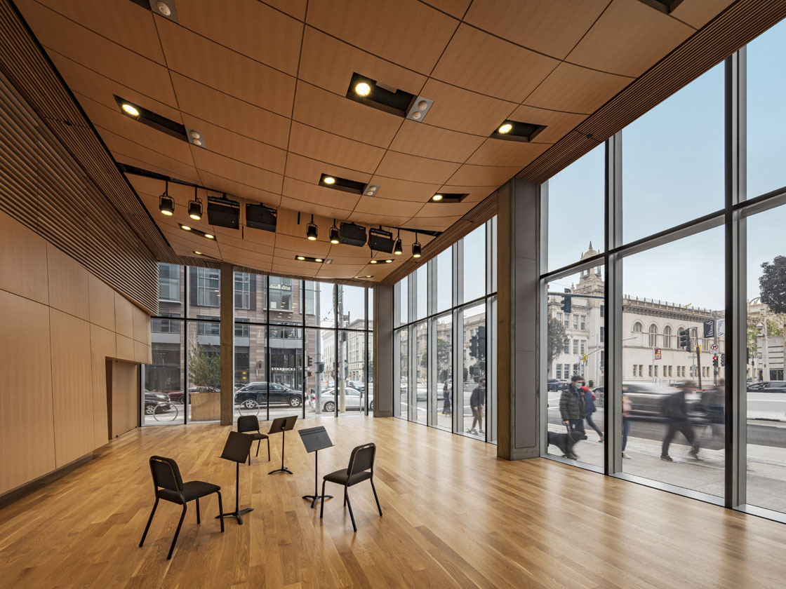 Ground floor performance area with floor to ceiling windows.