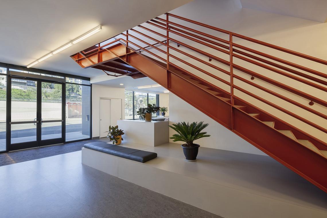 Interior view of lobby and open stairway to upper floor