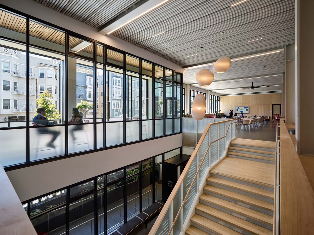 interior stair case looking across top of stair case with view of terrace.