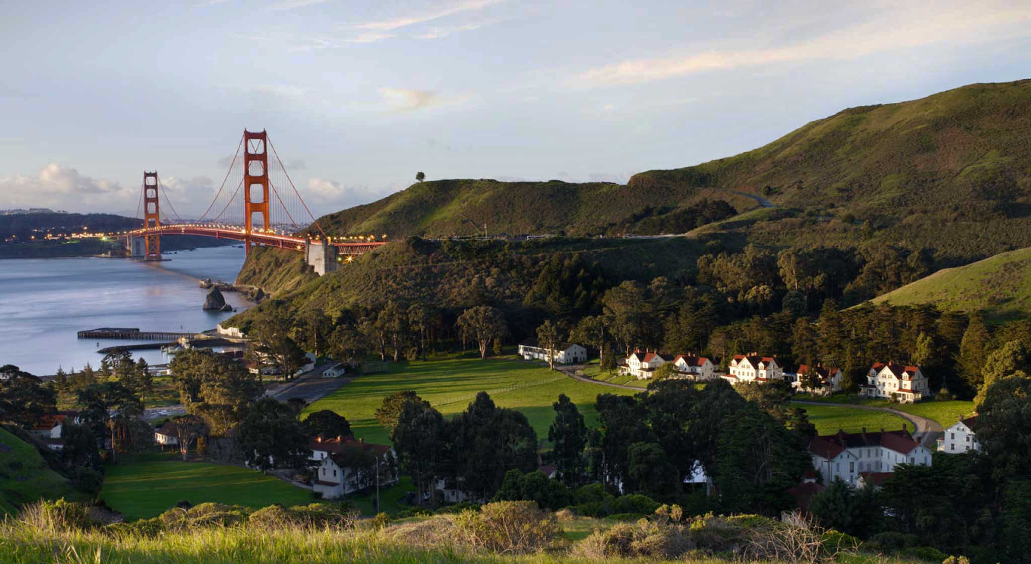 Exterior view overlooking the Cavallo Point Lodge at Fort Baker with the golden gate bridge in the background.