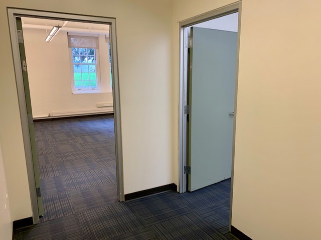 Entrance area showing doors to two separate office areas