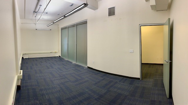 Open office area with frost glass walls.