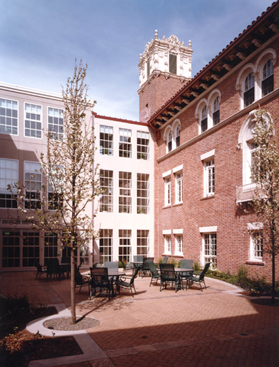 Courtyard view of new building and historic brick building.