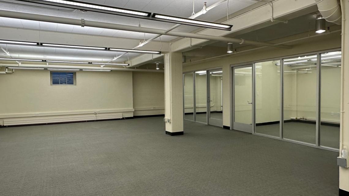 Unfurnished, carpeted office space, view from entry