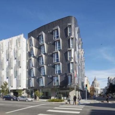 Exterior corner view of 388 Fulton at Gough Street; distinct black cladding is accented staggered windows.