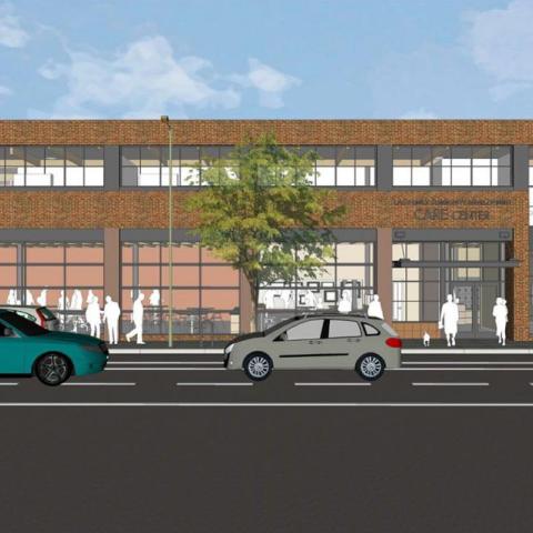 Street-level rendering of two-level building with brick façade and large windows along 12th Street in Oakland